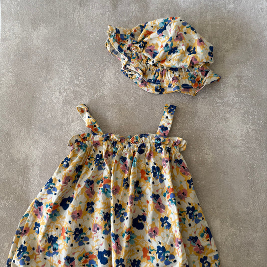 Blauw/geel bloemen rompertje