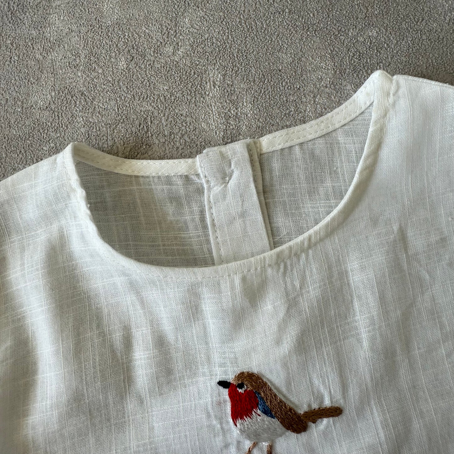 Shirt met geborduurde vogel