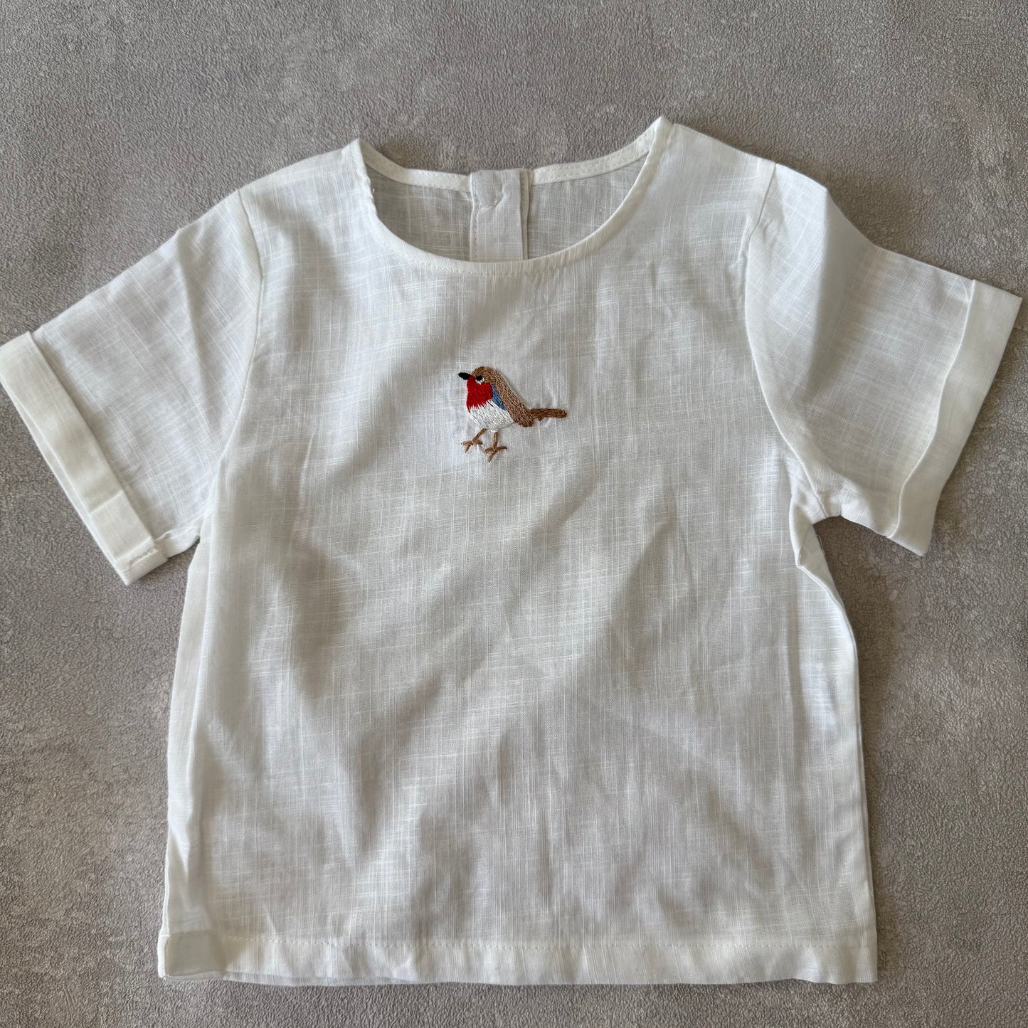 Shirt met geborduurde vogel